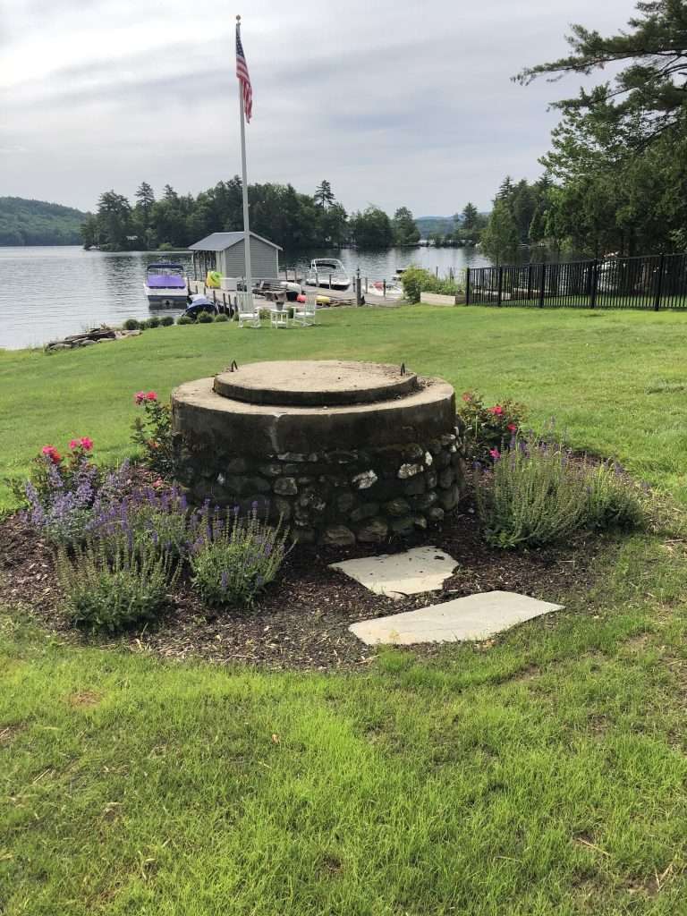 bed around well and flag pole