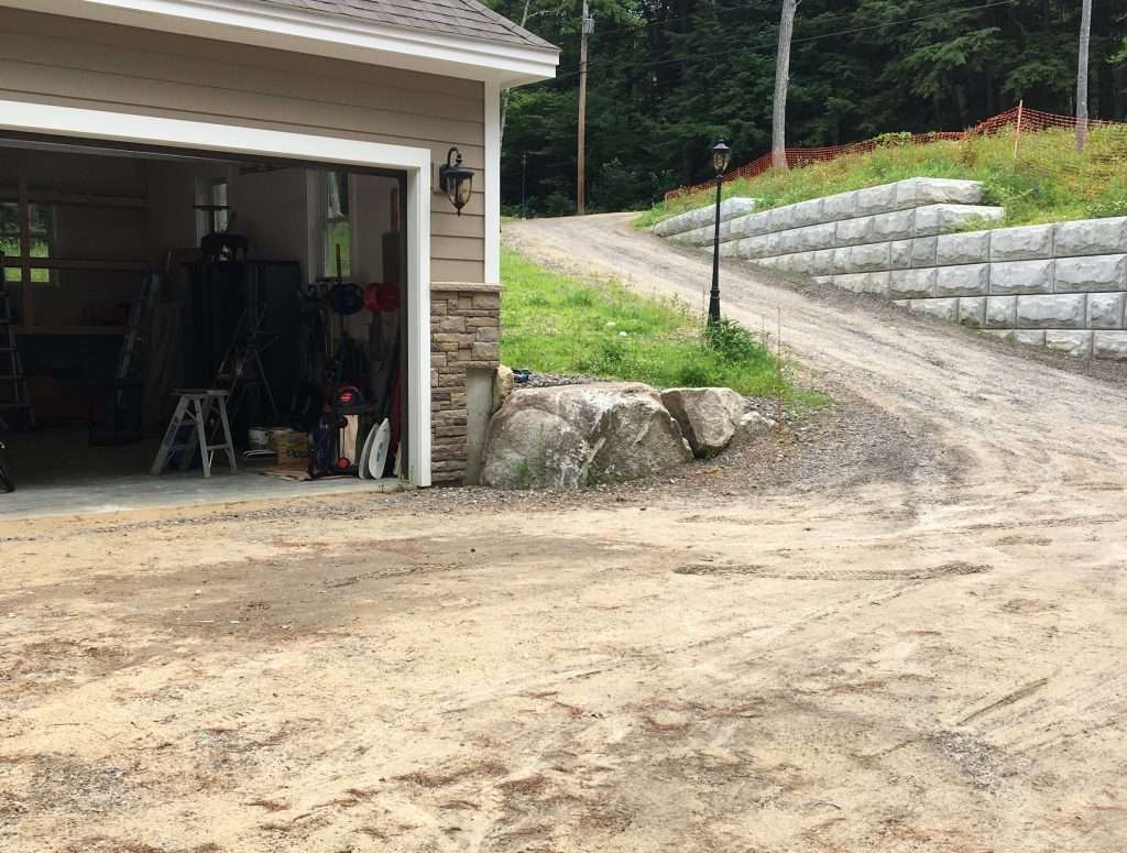 Retaining wall construction and driveway excavation project by Landscapes by Tom in New Hampshire