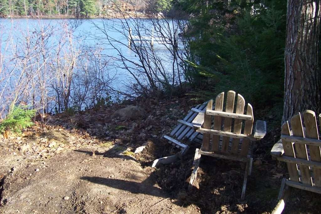 Before photo of a backyard sitting area prior to custom patio and landscape installation by Landscapes by Tom in New Hampshire