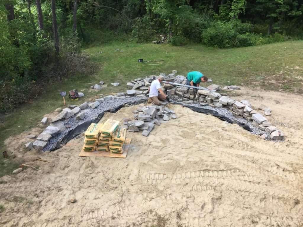 Before photo of a backyard area prior to custom fire pit patio and landscape installation by Landscapes by Tom in New Hampshire