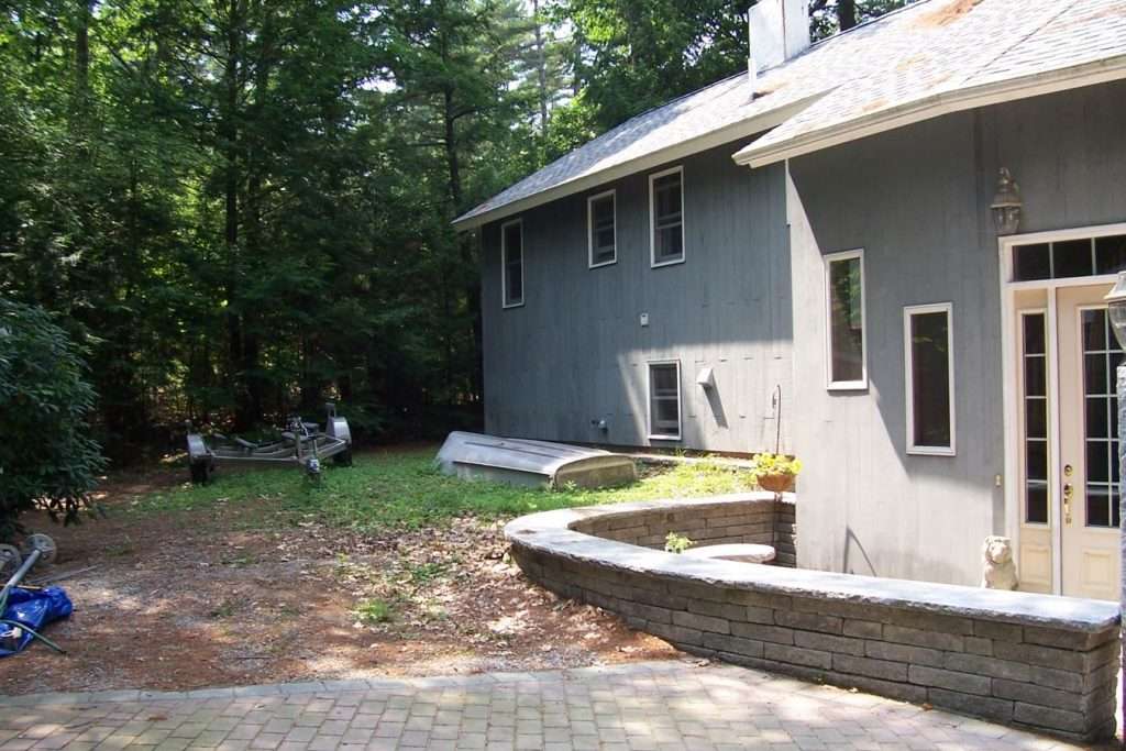 https://landscapesbytom-com.seethewebdev.com/wp-content/uploads/2024/03/BeforeandAfter201801-1074-Beforecourtyardpath1.jpeg