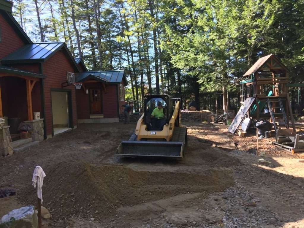 Permeable paver patio installation for a Lake Winnipesaukee waterfront home by Landscapes by Tom in New Hampshire