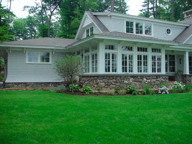 White garden landscape inspiration featuring layered flowering perennials, ornamental shrubs, seasonal bloom planning, and elegant monochromatic garden design ideas for a New Hampshire landscape
