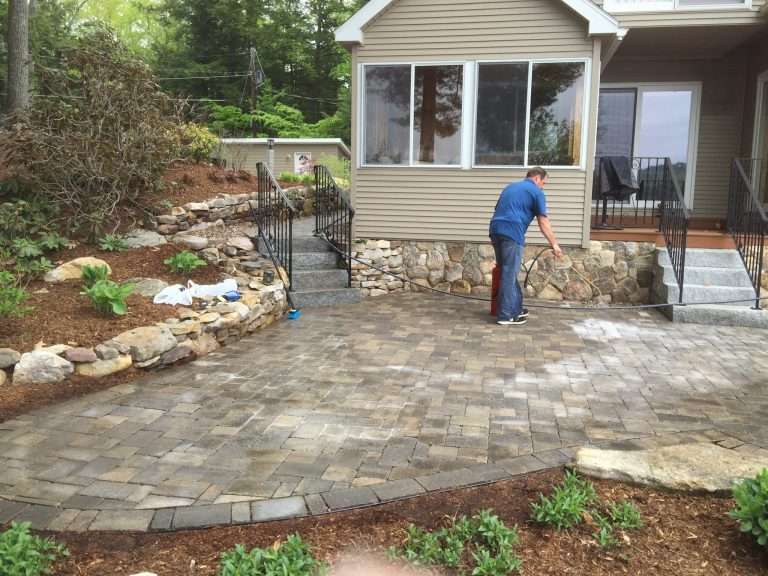 Spring landscape cleanup services featuring mulch installation, perennial bed preparation, pruning, debris removal, lawn cleanup, and seasonal landscape maintenance for New Hampshire homes by Landscapes by Tom