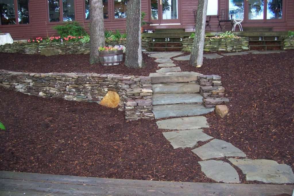 mulched beds and flagstone entry path